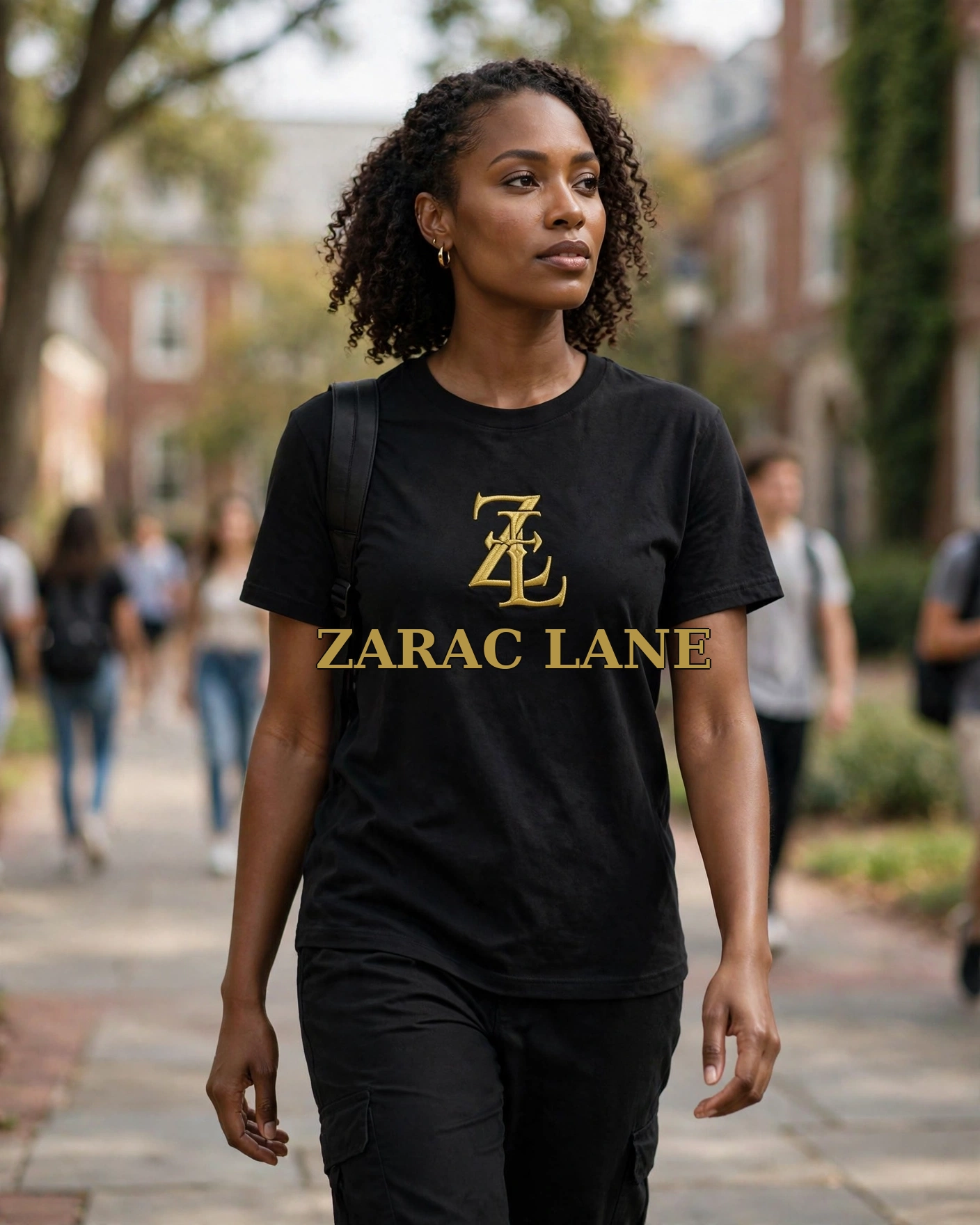 Person on a college campus wearing the black tee with gold ZL emblem